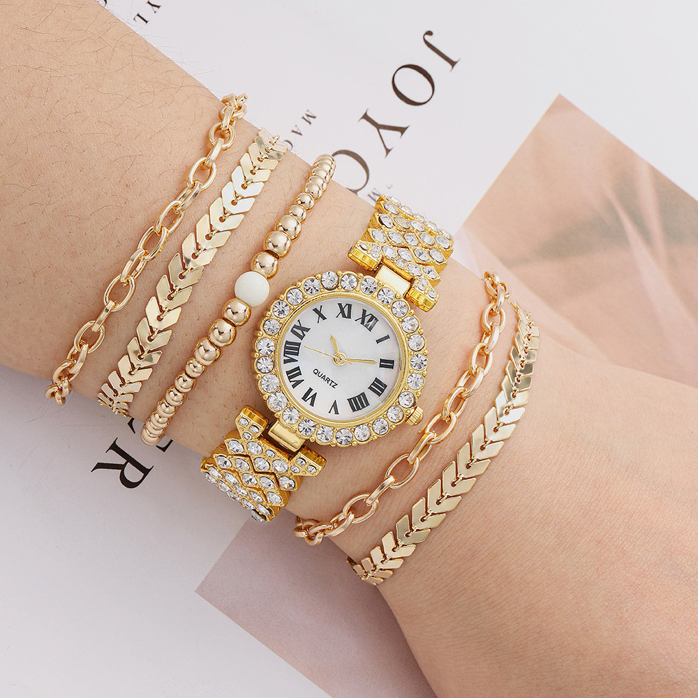 Golden watch and bracelets set