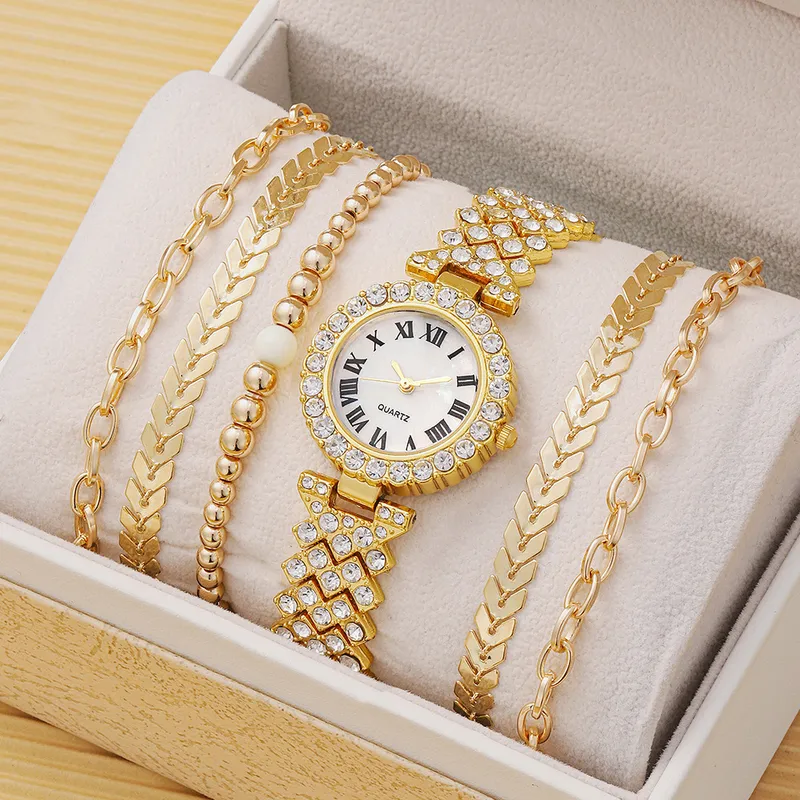 Golden watch and bracelets set