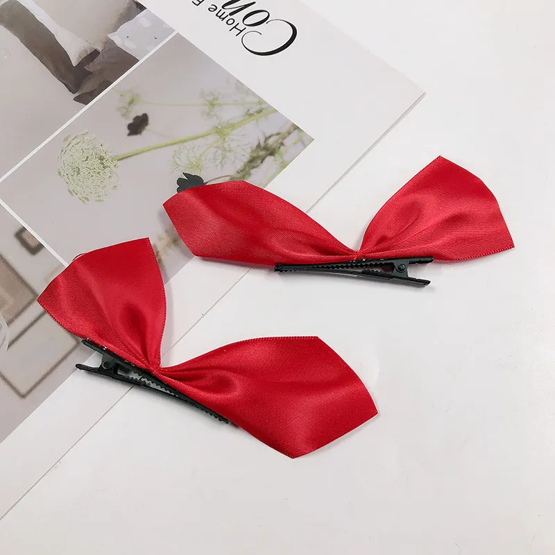 Hair clip, two pieces of red fabric